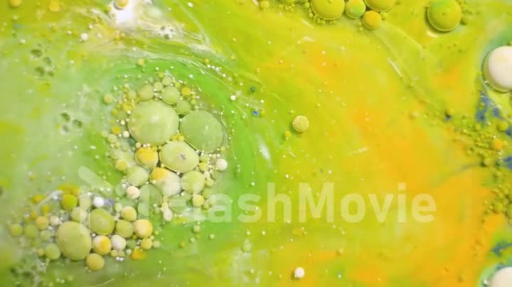 Colorful sparkling paints mix in beautiful patterns