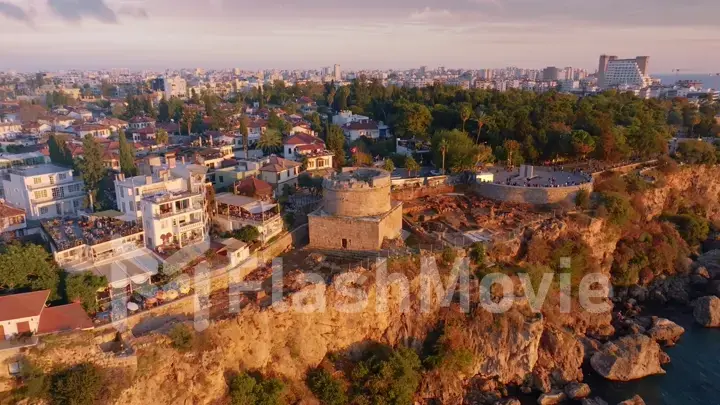 Aerial drone view of fortress. Flight over the picturesque city at sunset. Top view of the roofs of houses. Landscape