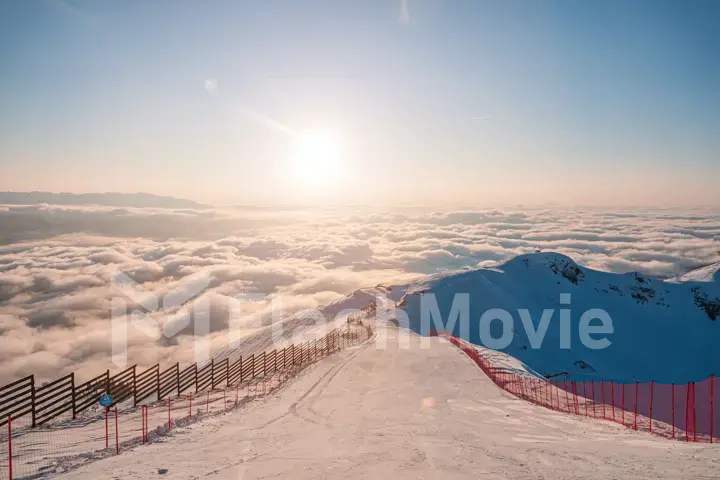 Alpine landscape of snow covered mountains and blue sky