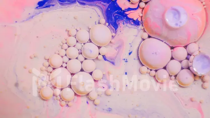 Bright colorful bubbles on the surface of the water. Abstract paint bubbles