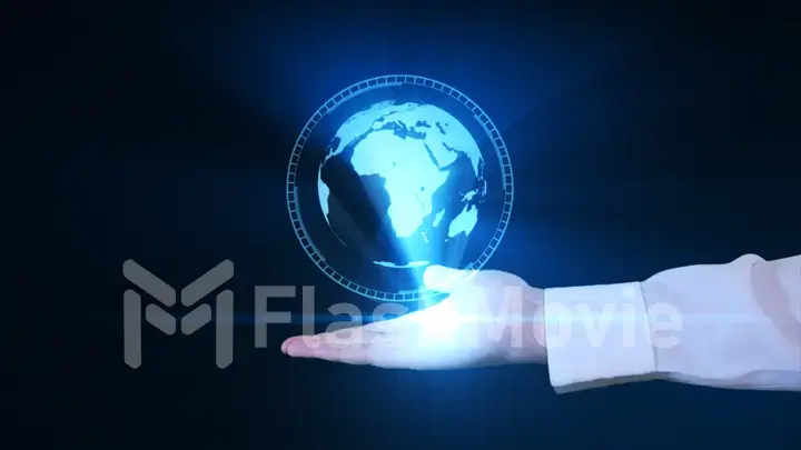 A businessman is holding a hologram of planet earth in his hand. Futuristic interface
