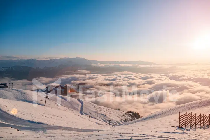 Alpine landscape of snow covered mountains and blue sky