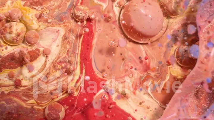 Multi-colored acrylic paint in motion. Slow motion. Fantastic surface. Abstract colorful paint. Top view
