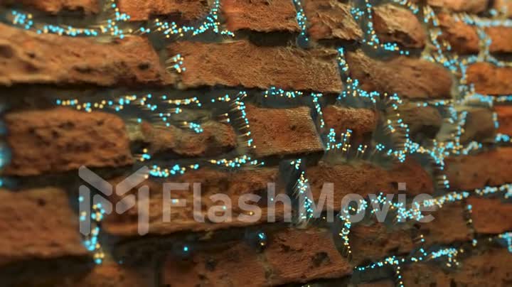 Fiber optic spreads appears between the bricks and spreads along the brick wall. Abstract technology background.