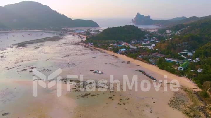 Phi Phi Islands Panorama, Krabi Province, Thailand Thai. Spectacular color sunset over the sea and islands. Amazing twilight in the tropics and calm indian ocean