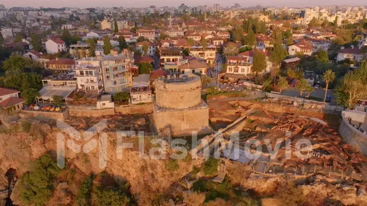 View over the red roofs and medieval wall of the old city. Sunset. Panorama. Aerial drone view