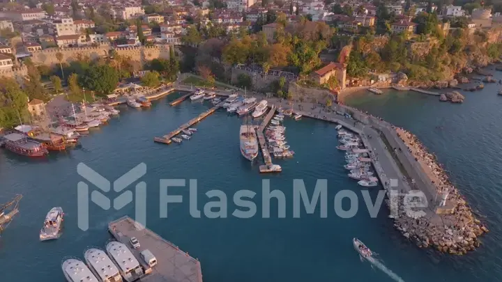 Aerial view of amazing boats. Marina bay. Top view from drone of harbor with yacht, motorboat and sailboat. Seascape