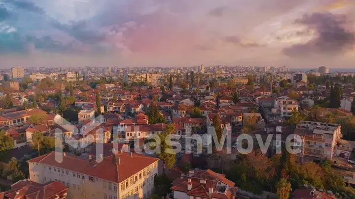 Aerial drone view of fortress. Flight over the picturesque city at sunset. Top view of the roofs of houses. Landscape