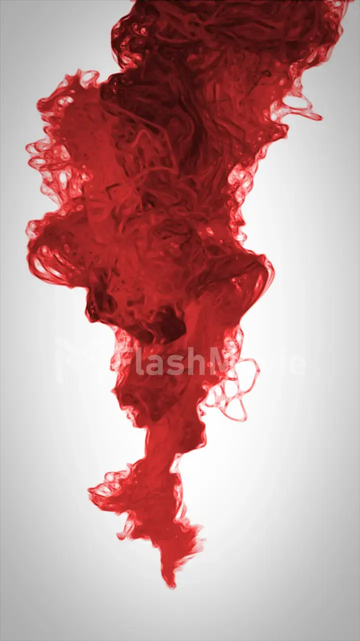 red color paint pouring in water
