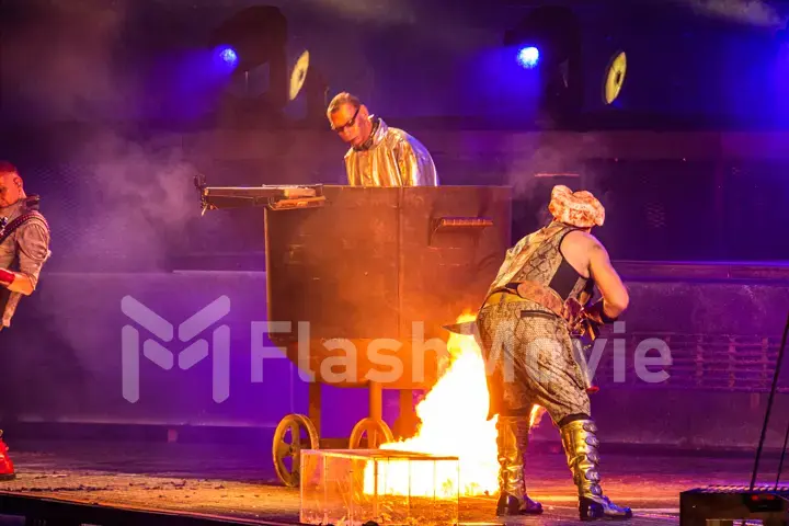 MOSCOW, RUSSIA - JULY 29, 2019: Rammstein group fire concert at Luzhniki Stadium. Crowds of fans gathered at a rock concert of their favorite metal band.