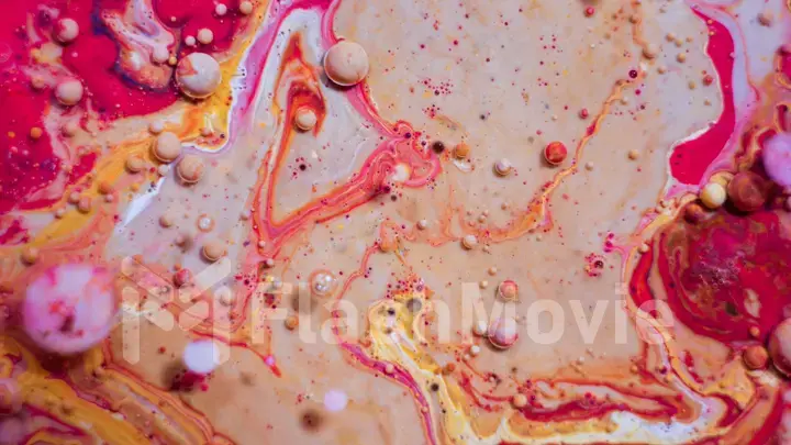 Bright colorful red bubbles on the surface of the water. Abstract paint bubbles