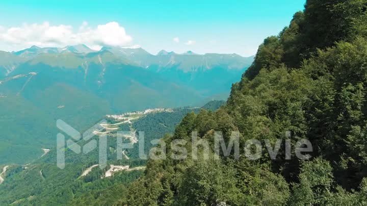 Aerial 4k view. Beautiful summer landscape of mountains and forest. Bird's-eye.