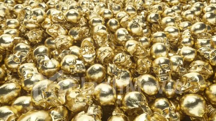 A bunch of golden skulls lie on top of each other
