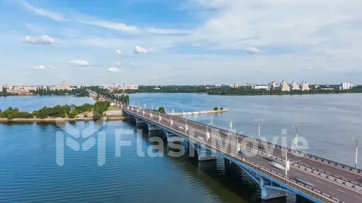 Aerial hyperlapse video with view of Bridge, cars moving fast on a bridge on a sunny day