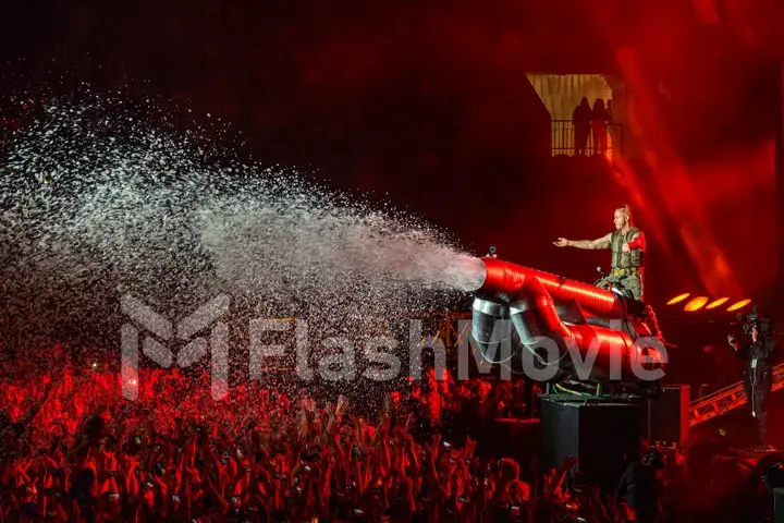 MOSCOW, RUSSIA - JULY 29, 2019: Rammstein group fire concert at Luzhniki Stadium. Crowds of fans gathered at a rock concert of their favorite metal band.