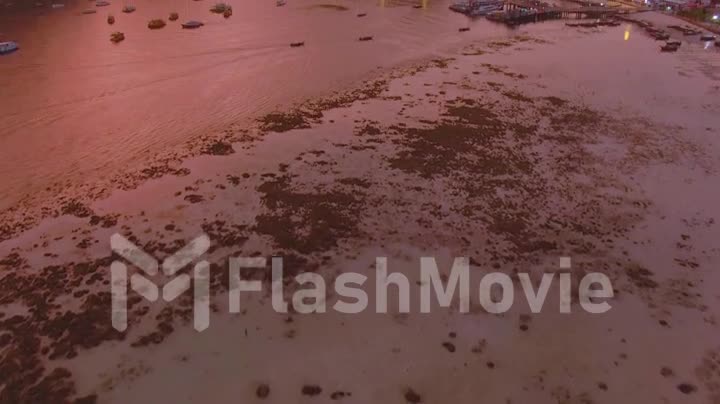 Panorama of Phi Phi island, Krabi province, Thailand. Spectacular color sunset over the sea and islands. Amazing twilight in the tropics and calm Indian Ocean. Aerial 4k view