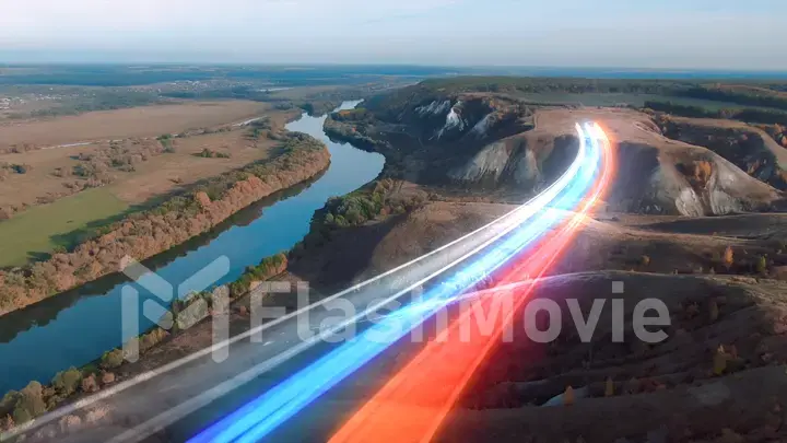 4k Aerial view The concept of disseminating information, data flows over a natural landscape with a river and mountains