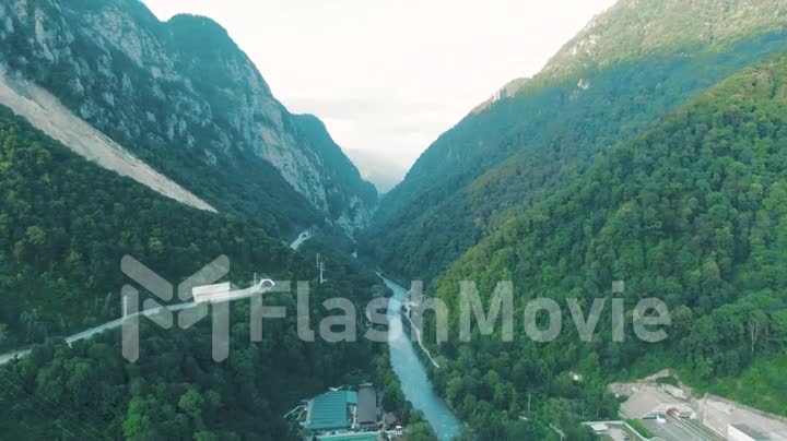 Aerial 4k view. Beautiful summer landscape of mountains and forest. Bird's-eye.