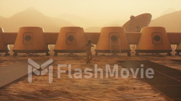 Astronaut on the planet Mars performing a dance at his base. Small dust storm. The satellite dish sends data to the ground. Realistic 3D animation