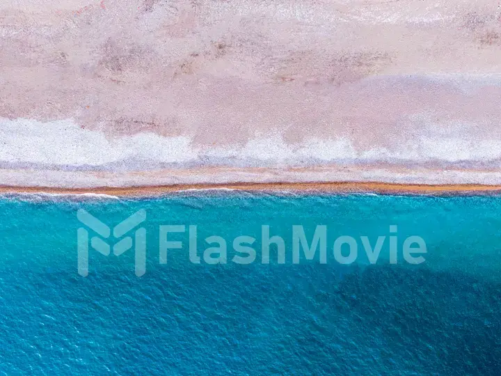 Soft wave of blue ocean on sandy beach. Background. Aerial view