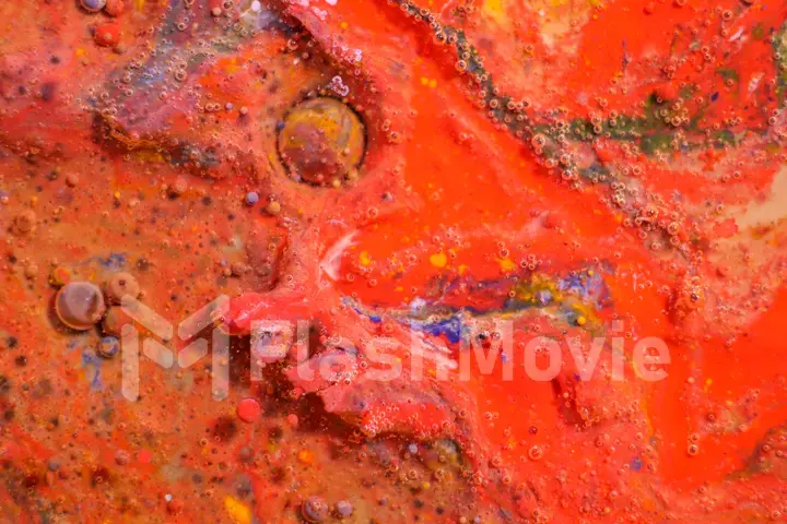 Bright colorful red bubbles on the surface of the water. Abstract paint bubbles