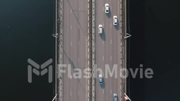 4k Aerial top down view of traffic of cars on the bridge in a populated city