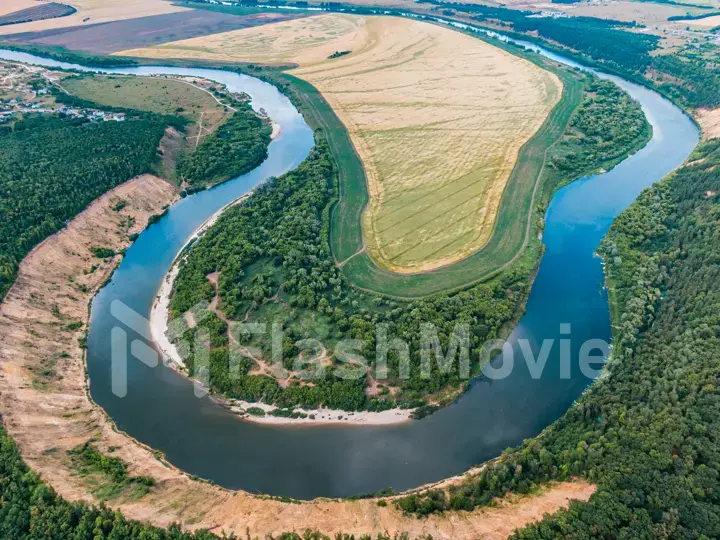 aerial landscape of winding river in green field, top view of beautiful nature texture from drone