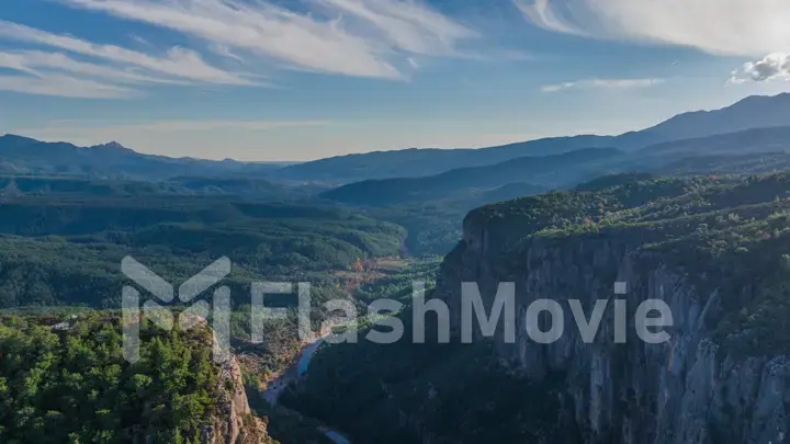 Aerial drone view magic landscape. Mountain gorge. Majestic canyon. Stone rocks and green trees. Sunny day