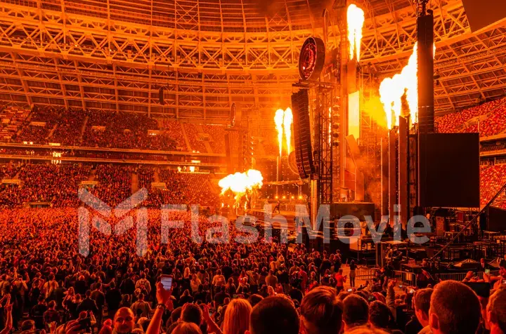 MOSCOW, RUSSIA - JULY 29, 2019: Rammstein group fire concert at Luzhniki Stadium. Crowds of fans gathered at a rock concert of their favorite metal band.