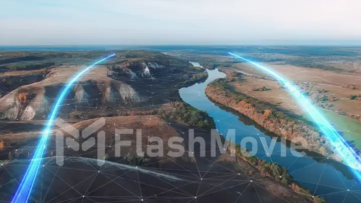 4k Aerial view The concept of disseminating information, data flows over a natural landscape with a river and mountains