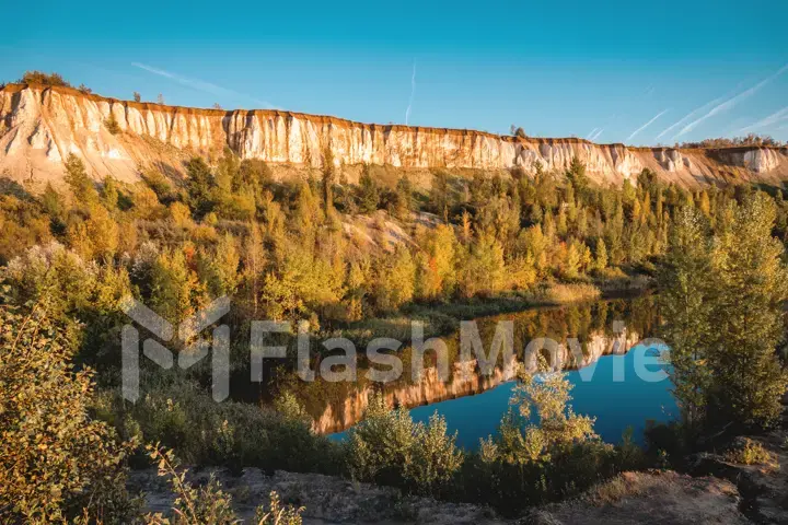 Aerial footage of chalk mountains and nature, a lake and a beautiful landscape