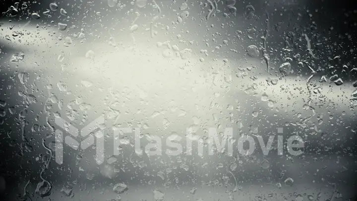 The sun in the clouds shines through the glass in the rain drops. Black and white illustration