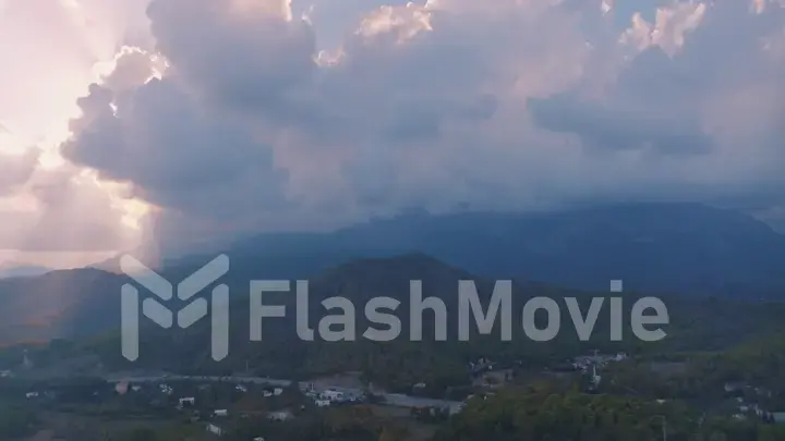 Beautiful landscape. Aerial view of the resort town. Sunset sky. Mountains in the background. Photography