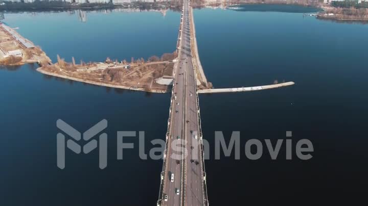 4k Aerial view of traffic of cars on the bridge in a populated city