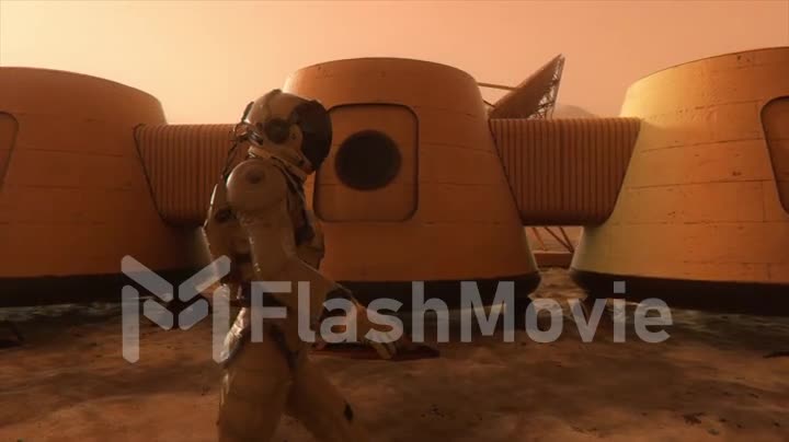 Astronaut on the planet Mars, making a detour around his base. Astronaut walking along the base. Small dust storm. The satellite dish sends data to the ground. Realistic 3D animation