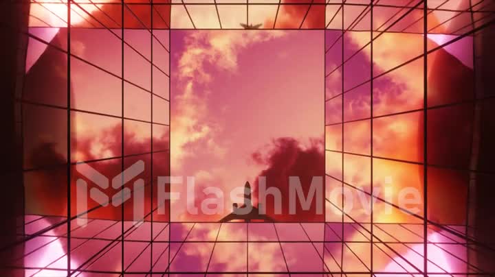 Passenger plane flying in the sky with clouds over a modern glass building at sunset. Bottom view. Travel concept. 3d animation.