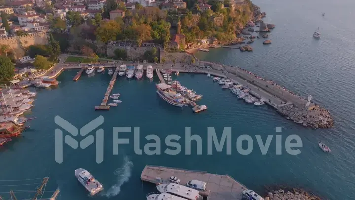 Aerial view of amazing boats. Marina bay. Top view from drone of harbor with yacht, motorboat and sailboat. Seascape