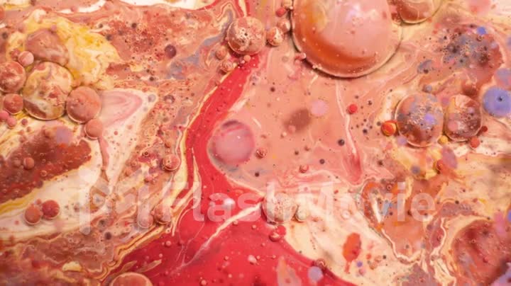 Multi-colored acrylic paint in motion. Slow motion. Fantastic surface. Abstract colorful paint. Top view
