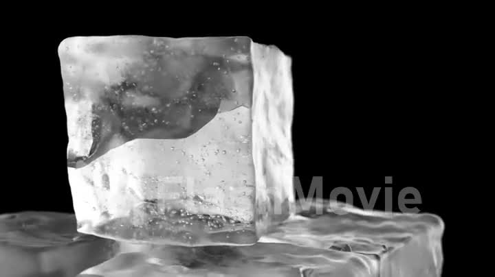 Looping rotation of ice cubes on a black isolated background