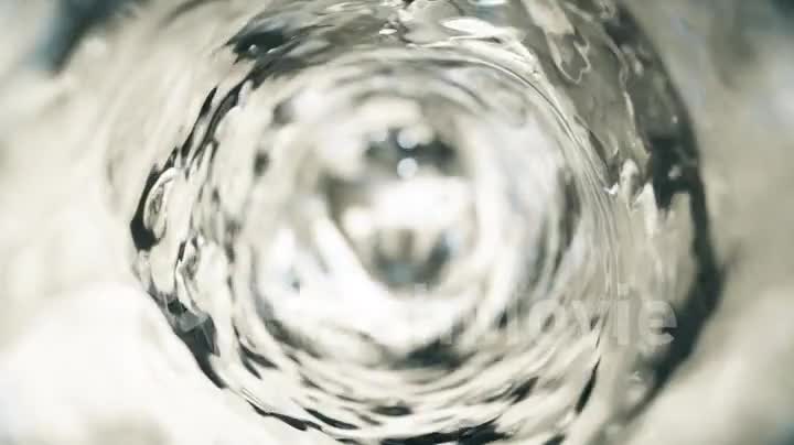 Water moves in a glass in slow motion. Abstract water background. Seamless loop 3d render