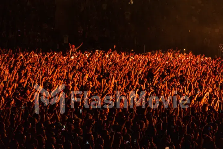 MOSCOW, RUSSIA - JULY 29, 2019: Rammstein group fire concert at Luzhniki Stadium. Crowds of fans gathered at a rock concert of their favorite metal band.