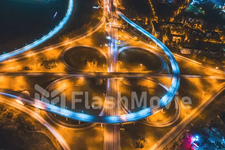 Aerial 4k view.Hyperlapse timelapse of Urban night traffic on a roundabout in the form of circles and eight