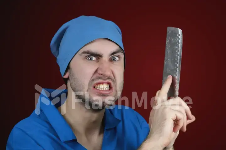 Angry crazy bearded doctor with a butcher knife