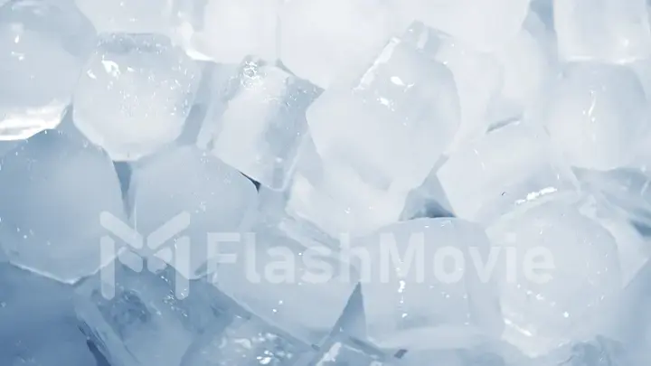 Macro shot of ice cubes from clear water that melt in slow motion on a white background. Concept: pure mountain spring water, ice, cocktails, fresh and frozen foods.