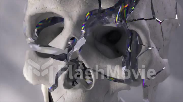 The concept of horror and destruction. Diamond skull breaks. Slow motion. White background. Shatter. 3d animation.