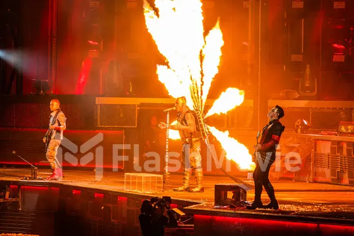 MOSCOW, RUSSIA - JULY 29, 2019: Rammstein group fire concert at Luzhniki Stadium. Crowds of fans gathered at a rock concert of their favorite metal band.