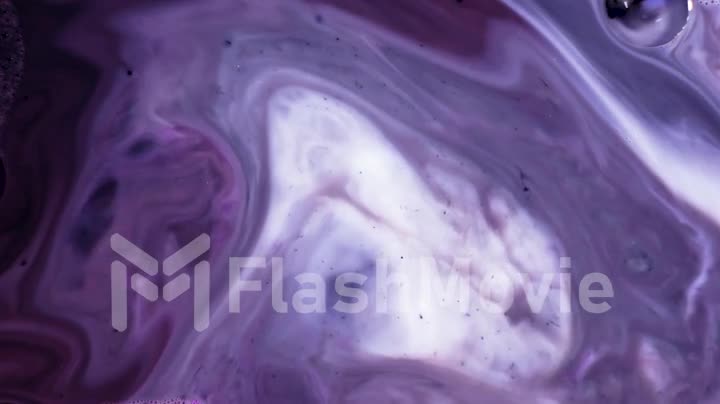 Multicolored acrylic paint. Slow motion. Fantastic surface. Abstract colorful paint. Top view