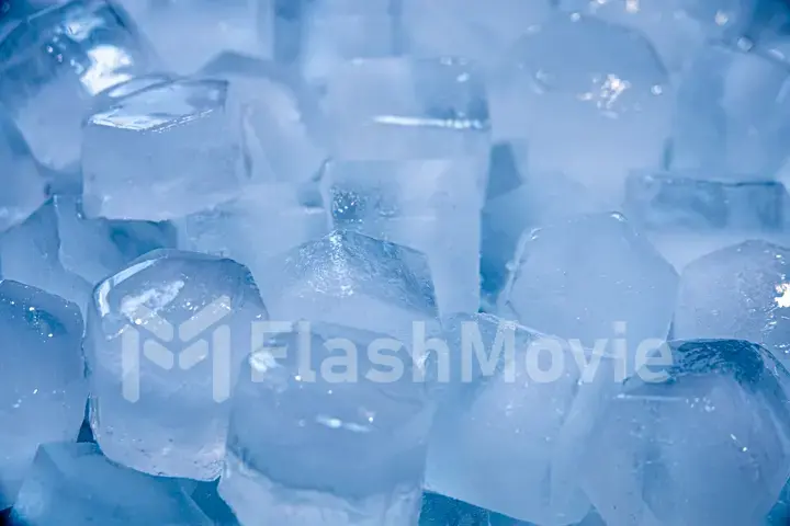 Macro shot of ice cubes from clear water that melt in slow motion on a white background. Concept: pure mountain spring water, ice, cocktails, fresh and frozen foods.