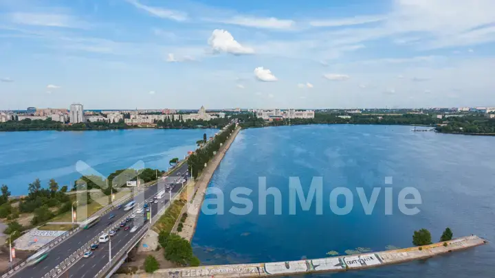 Aerial hyperlapse video with view of Bridge, cars moving fast on a bridge on a sunny day