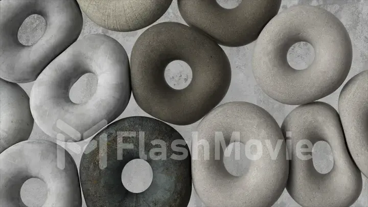 Soft gray donuts fly against the background of a concrete wall. Abstract concept. Round objects. Toys. 3d illustration